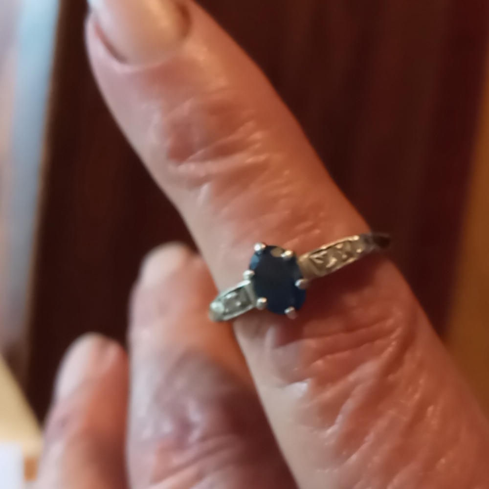 Dark bluevsapphire ring with diamonds